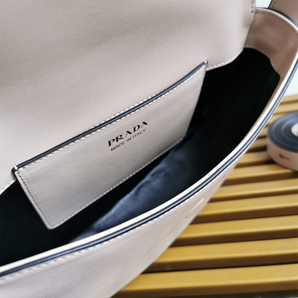 Pra*a Arque leather shoulder bag with flap